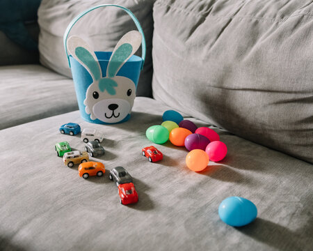 Toy cars and plastic Easter eggs