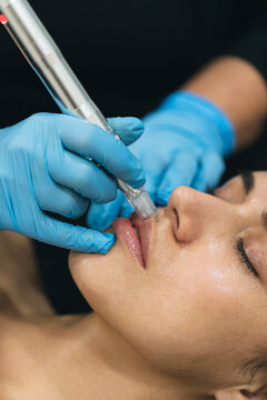 Airbrush Facial Oxygen therapy working on a skin face, inside Spa center.