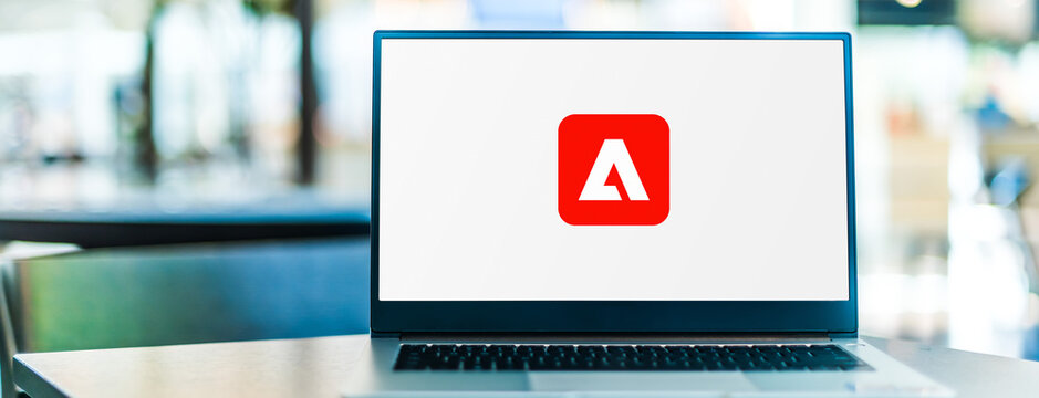 Laptop computer displaying logo of Adobe Experience Cloud