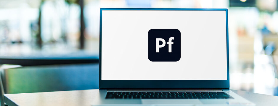 Laptop computer displaying logo of Adobe Portfolio