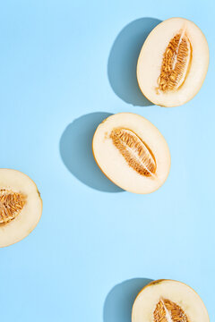 Fresh Canary Melon on a blue surface