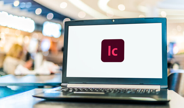 Laptop computer displaying logo of Adobe InCopy