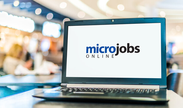 Laptop computer displaying the sign "micro jobs online"