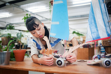 Young adult woman in workshop