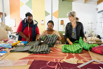 A diverse group of women clothing designers