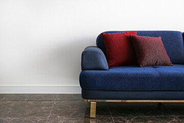 Cropped shot of colorful couch and cushions in waiting room. Close up, copy space, background.