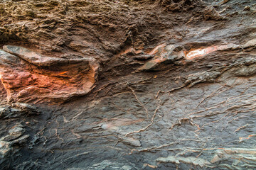 Stone wall with orange textures.