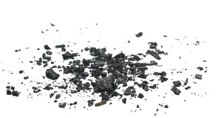 Charcoal chunks pile isolated on white background, side view