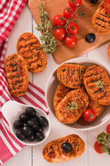 Toasted bread with tomato and oregano.