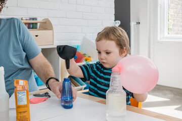Toddler doing science experiment
