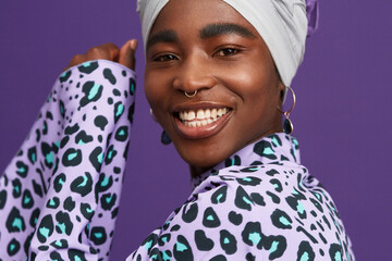 Happy woman in headwrap and animal print