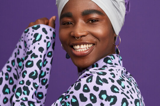 Happy woman in headwrap and animal print