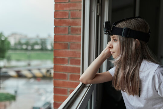 Girl watching from the window.