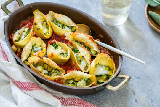 Pasta Shells filled with courgettes and cheese baked in tomato sauce