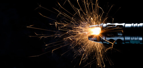 Sparks flying from the barrel of a gun