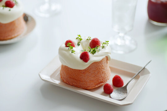 Home made pink strawberry cake, on the table.