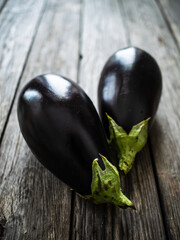 Ripe aubergine on wooden table