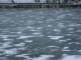 snow on a frozen pond