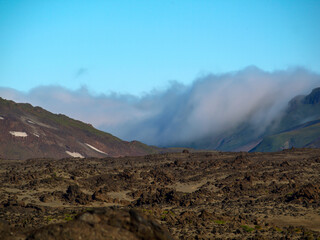 Mutnovsky volcano. A cloud lies on the slope of a mountain valley
