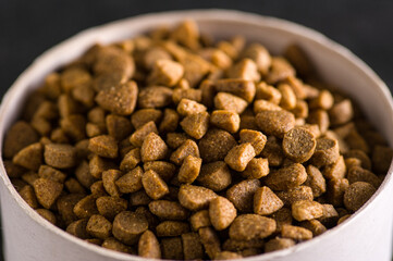 Premium natural dry food for cats and dogs. Complete food for a good activity and a healthy life for your pet. Close-up of granules