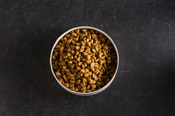 Premium natural dry food for cats and dogs. Complete food for a good activity and a healthy life for your pet. Top view of granules