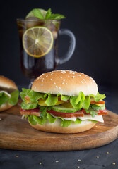 Hamburger and a refreshing drink on the table.