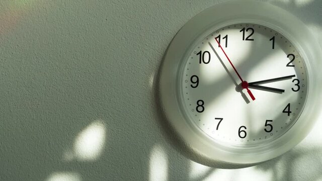 Wall clock show the running time. Time lapse and moving on dolly stabilizer