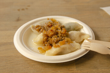 
bright dumplings with cheese and roux