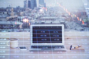 Financial graph colorful drawing and table with computer on background. Double exposure. Concept of...