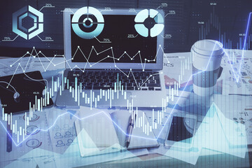 Stock market graph and table with computer background. Double exposure. Concept of financial analysis.