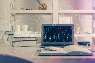 Financial graph colorful drawing and table with computer on background. Double exposure. Concept of...