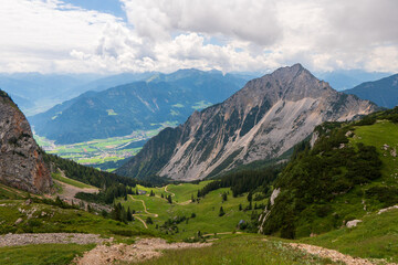 summer mountains green grass and blue sky landscape near achensee in austria, europe alps in cloudy day