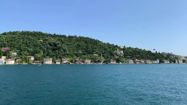 Footage of Anadolu hisari / Kandilli area of Istanbul by Bosphorus. Beautiful scene. It is a sunny summer day. Camera moves forward.