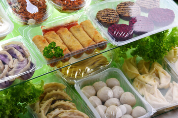 A variety of prepackaged food products in plastic boxes