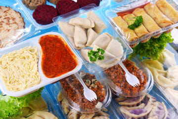 A variety of prepackaged food products in plastic boxes