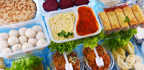 A variety of prepackaged food products in plastic boxes