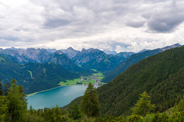 Fototapeta na wymiar Achensee, Austria in it's beauty surrounded with mountains and cloud