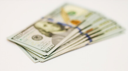 Stacks of paper 100 dollars USA on the white background