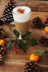 Obraz na płótnie Canvas Coffee latte with cinnamon on Christmas background