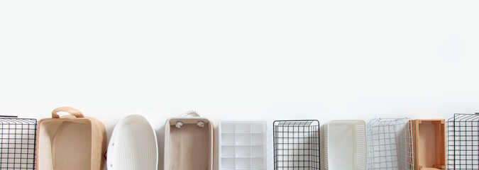 Top view of closet organization boxes and steel wire baskets in different shapes.