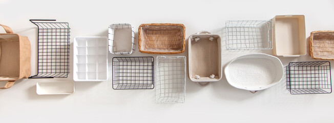 Top view of closet organization boxes and steel wire baskets in different shapes.