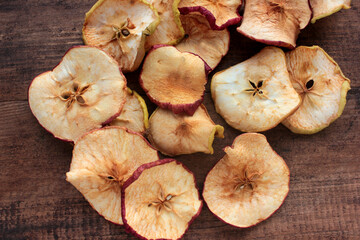 Dried fruits apples rings on wooden background. Top view. Rustic style