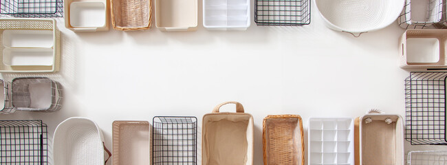 Top view of closet organization boxes and steel wire baskets in different shapes.