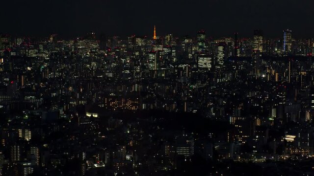 TOKYO, JAPAN : Aerial high angle sunrise CITYSCAPE of TOKYO. View of office buildings around Shinjuku and Minato ward. Japanese urban metropolis concept. Time lapse zoom out shot night to morning.