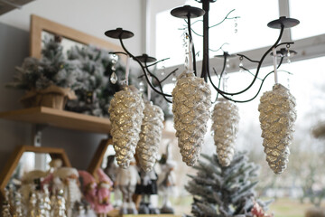 Decorative cones hanging on the chandelier, christmas decoration