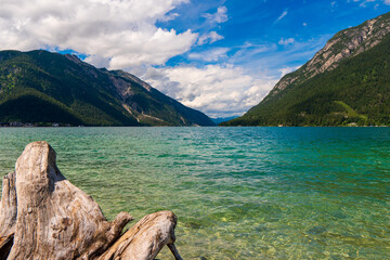 Fototapeta na wymiar Cystal clear water of Achensee lake near Pertisau town on sunny summer day, Tirol, Austria