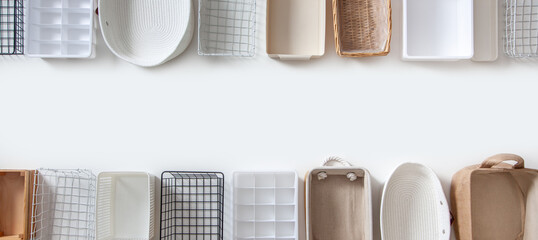 Top view of closet organization boxes and steel wire baskets in different shapes.