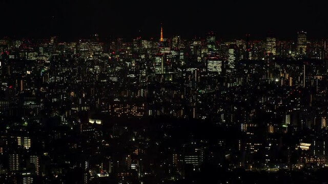 TOKYO, JAPAN : Aerial high angle sunrise CITYSCAPE of TOKYO. View of office buildings around Shinjuku and Minato ward. Japanese urban metropolis concept. Time lapse zoom out shot night to morning.