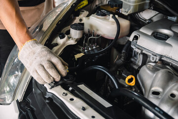 Obraz na płótnie Canvas Auto mechanic Repair maintenance and car inspection