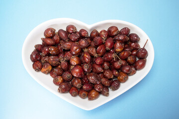 Dried Rosehips are in heart shaped bow  